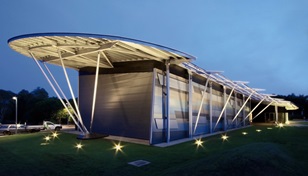 The wall features variously placed Stramit Corrugated panels made from COLORBOND® Metallic steel in the colours Citi®, Conservatory®, Cortex®, Facade® and Skybridge®.
